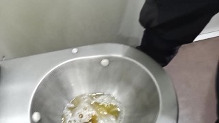 pissing in a public toilet on train