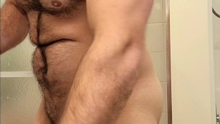 Hairy muscle bear flexing before shower!