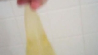 Playing with my piss filled rubber