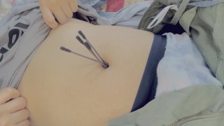 cute boy loves pick own belly button by cotton swabs