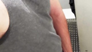 Horny jock plays with his thick cut cock in the gym showers