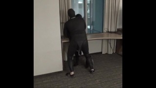 wetsuited guy fucking dummy at hotel window