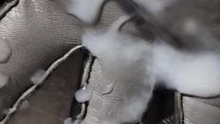 Cumming on a grey leather glove