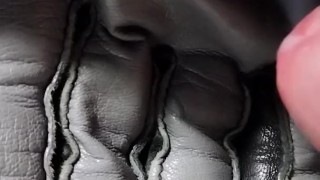 Cumming on a grey leather glove