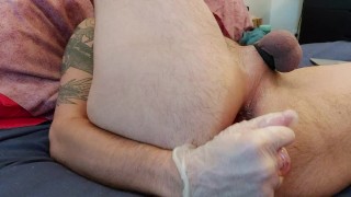 straight man inserting a pink toy in his ass