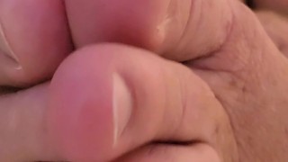 kicking back in bed, wiggling MY toes and stroking MY cock....