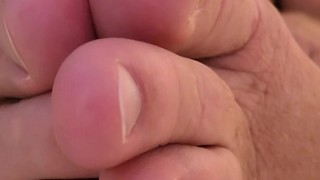 kicking back in bed, wiggling MY toes and stroking MY cock....