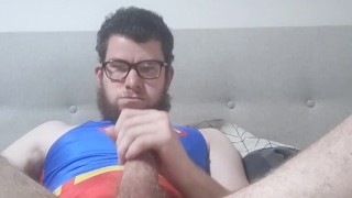 man masterbates in a superman one piece swimsuit