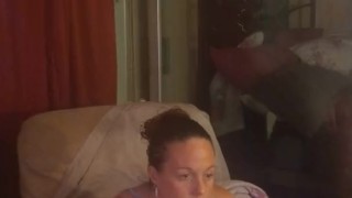 Amateur milf takes off her mini dress and lays on the couch in lingerie playing video games