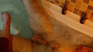 Man washes another guy's feet and ass in the bath, fingering, handjob. POV video