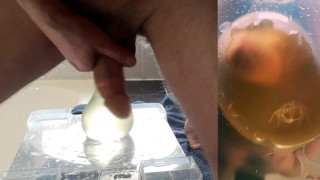 beautiful hard cock pisses in condom and fucks his pee into big cumshot with floating sperm