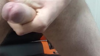 handsome bearded guy masturbates on a chair