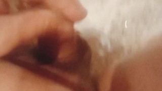 Young fat guy takes a shower and massages his dick with a shower