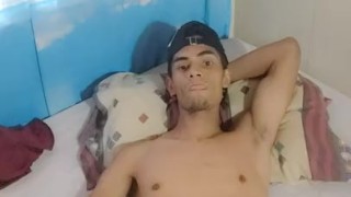 cute boy playing with his feet and dick