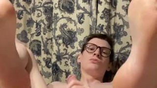 Amateur twink shows off his feet and plays with a dildo