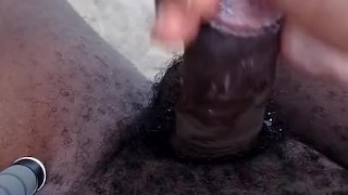 Cumshot after stroking my black uncut cock outdoor