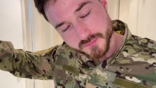 Soldier strip tease and muscle flexing