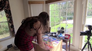 Big fake tits crossdresser doing arts and crafts in front of open window