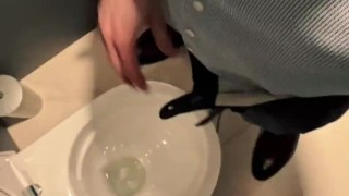 Man unzips his pants pissing in office toilet and shows his wet cock close to camera
