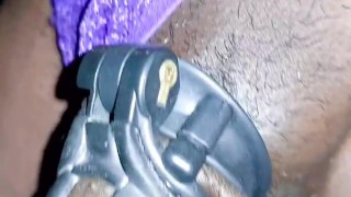 Sissy shemale piss walking while in chastity cage and butt plug