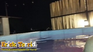 What two guys doing in the swimming pool when in public