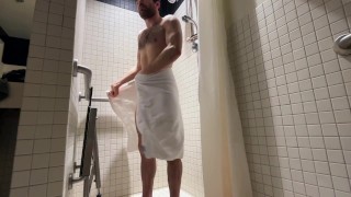 Fitness model showering after workout