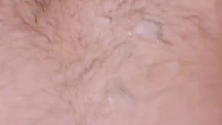 Thong wearing dude shows his hole and jerks off until he shoots a load over his hairy chest.