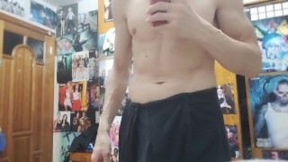 Young guy getting dressed after shower