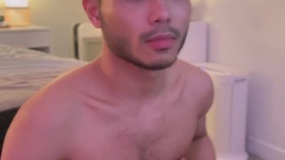 Asian boy stroking cock
