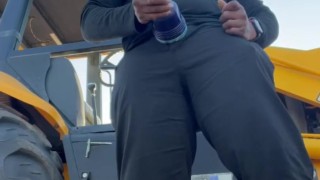 (Fleshbating near a tractor)