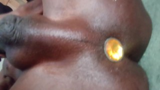 Ebony Twink cums while fucking himself.