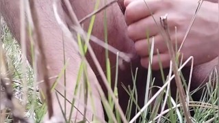 Young guy masturbates in the mountains