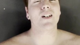 Ginger jock strokes his cock on the gym floor