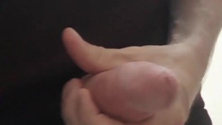 Jacking off in the men's restroom at work. Freeballing makes me horny