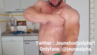bodybuilder with oiled body jerks off and flexes
