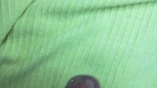 Painted nails on a green sheet