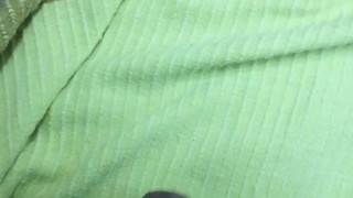 Painted nails on a green sheet