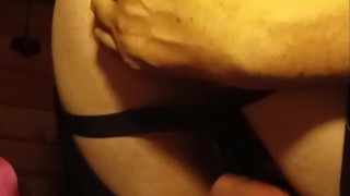 Chastity inserting big buttplug