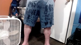 standing pissing in under armour shorts