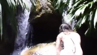 beautiful european girl swims naked in the river