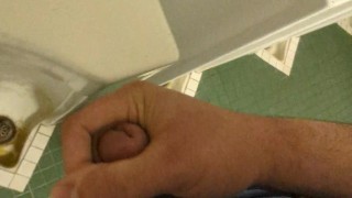 Risky Wank: horny hung bear jerks in a public university restroom, leaves sticky cum