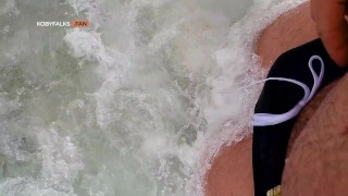 Handsome muscle daddy Koby Falks has his uncut cock sucked in the beach dunes