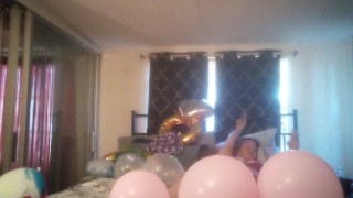 Milf with extreme long hair popping balloons and smoking cigarettes while filming up her own skirt