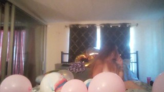 Extremely horny girl takes off her dress and smokes cigarettes and pops balloons naked