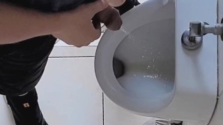 Risky wank in public urinal at work. Man's room