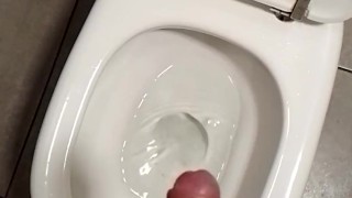 Teen boy jerks off in the public toilet Understall and make cum