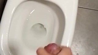 Teen boy jerks off in the public toilet Understall and make cum