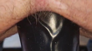 Taking the knot on the large knotted dildo