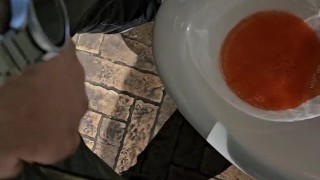 Pissing in a public urinal