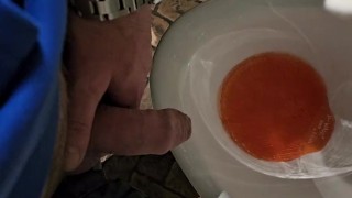 Pissing in a public urinal